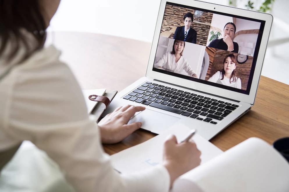 Laptop with people on